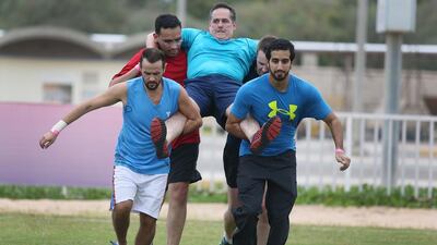 Carry your boss was one of the Mubadala challenges at Zayed Sports City. Delores Johnson / The National