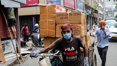 The Indian economy is reeling from a rise in Covid-19 infections - banks and major corporate borrowers in the country have turned to bond and equity markets this year to raise funds as they look to strengthen their capital base. AP Photo
