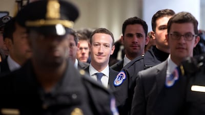 Mark Zuckerberg (centre) in Capitol Hill, Washington DC, yesterday. He is testifying before two Congressional hearings this week regarding Facebook allowing third-party applications to collect the data of its users without their permission. Michael Reynolds / EPA