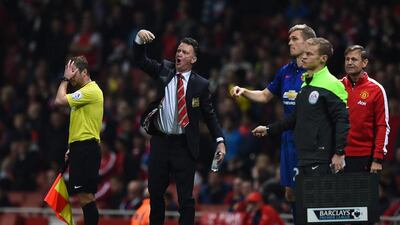 Louis van Gaal, centre, manager of Manchester United, gestures on the touchline during the Premier League match between Arsenal and Manchester United at Emirates Stadium on November 22, 2014 in London, England. Shaun Botterill/Getty Images