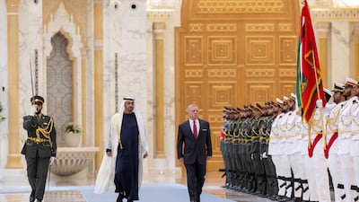 Sheikh Mohamed and King Abdullah inspect the honour guard in Abu Dhabi. Ryan Carter / UAE Presidential Court