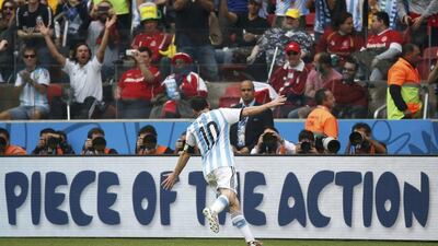 Lionel Messi celebrates his second goal against Nigeria on Wednesday in Argentina's 3-2 victory at the 2014 World Cup. Edgard Garrido / Reuters / June 25, 2014