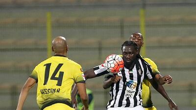 Al Jazira striker Kenwyne Jones, in black and white, holds up the ball during an Arabian Gulf League match against Al Jazira at Zabeel Stadium in Dubai on January 8, 2016. Ravindranath K / The National