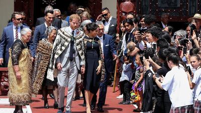 Prince Harry and Meghan depart the Tamatekapua meeting house on Te Papaiouru Marae in Rotorua. AFP