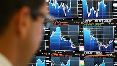 Trading screens at the offices of Panmure Gordon. The OECD said the global economy will 'remain resilient' over the coming years, but uncertainties and risks remain. Getty Images