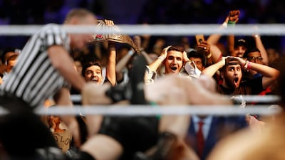 Fans shout during a wrestling match at the WWE Crown Jewel event at King Fahd International Stadium in Riyadh, Saudi Arabia. AP Photo