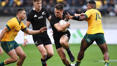 New Zealand's George Bridge runs between Australia's Filipo Daugunu, right, and James O'Connor, left, during the Bledisloe Cup rugby game between the All Blacks and the Wallabies in Wellington, New Zealand. AP Photo