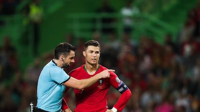 Portugal`s Cristiano Ronaldo (R) talks with Polish referee Daniel Stefanski during the UEFA Euro 2020 qualifying round Group B soccer match between Portugal and Luxembourg at Alvalade stadium in Lisbon, Portugal. EPA