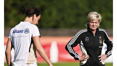 Silvia Neid, the Germany coach, right, believes her players need to relax.