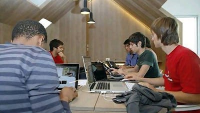 Participants discuss coding at a SeedStartup mentoring session. SeedStartup funds fledgling entrepreneurs. Antonie Robertson / The National