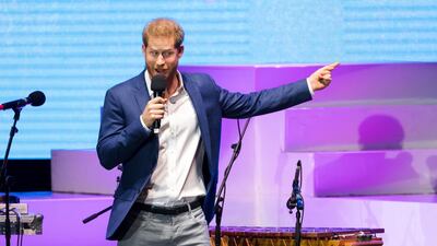 Prince Harry takes to the stage at the opening of the Sentebale Audi Concert at Hampton Court Palace. EPA