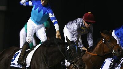 Joao Moreira riding Vivlos, left, wins the Dubai Turf. Francois Nel / Getty Images