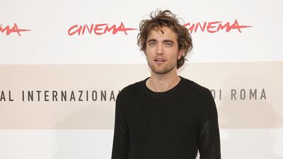 Robert Pattinson, in black jeans and a black jumper, attends the 'Twilight' photocall during the 3rd Rome International Film Festival on October 30, 2008. Getty Images