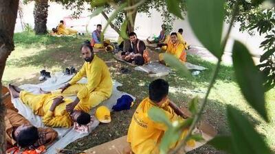 Workers take shelter from the scorching heat during their midday break in Abu Dhabi. Delores Johnson / The National