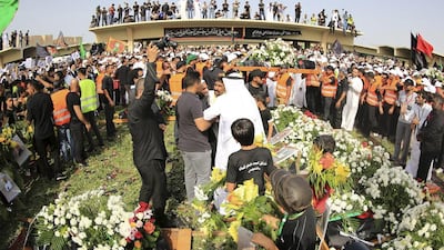 Shia Muslims attend a mass funeral for victims of the suicide attack on a mosque in Saudi Arabia. Reuters