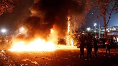 Protesters burn containers in the surroundings of Camp Nou stadium following el clasico. EPA