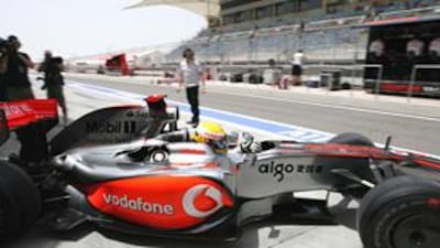 Lewis Hamilton sets off from the pits for his first practice round yesterday morning ahead of the Bahrain Grand Prix.