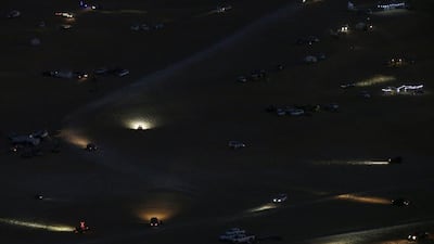Cars’ headlights illuminate the Liwa desert, some 250 kilometres southwest of Abu Dhabi. Karim Sahinb / AFP Photo