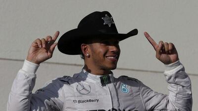 Mercedes driver Lewis Hamilton dons a cowboy hat and celebrates winning the US Grand Prix in Austin, Texas on Sunday. Adrees Latif / Reuters / November 2, 2014