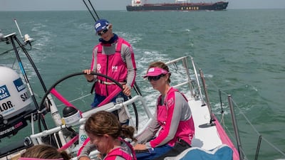 Team SCA navigate through the Singapore Straits on Thursday with a cargo boat behind them in view. Corinna Halloran / Team SCA / Volvo Ocean Race / January 22, 2015