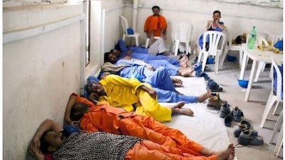 Labourers with Nurol Construction take their midday break on a project next to the Emirates Palace hotel.