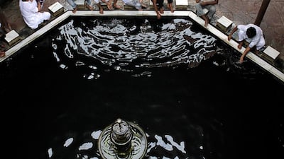Indian Muslims perform ablution before offering prayers at a mosque during the month of Ramadan in Kolkata, India on July 19, 2013. Bikas Das / AP Photo