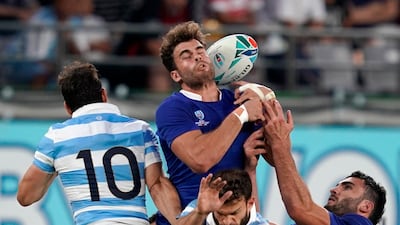 Damian Penaud (C) of France jumps to catch the ball against Argentina during the Rugby World Cup match between France and Argentina in Tokyo, Japan. France won the match. EPA