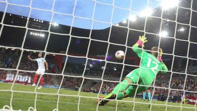 Germany's goalkeeper Julian Pollersbeck saves Nathan Redmond's penalty to eliminate England's Under-21 side from the European Championships. Andrzej Iwanczuk / Reuters