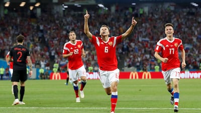 Russia's Denis Cheryshev celebrates scoring their first goal. Maxim Shemetov/Reuters