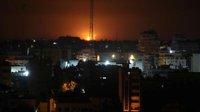 Flame and smoke are seen during an Israeli air strike in Gaza. Reuters