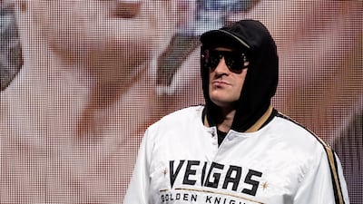 Tyson Fury arrives on stage for the last press conference. EPA