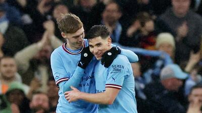 Julian Alvarez celebrates scoring their sixth goal with Cole Palmer. Reuters