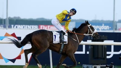 Mubtaahij, ridden ridden by Christophe Soumillon, wins the UAE Derby during the 2015 Dubai World Cup. Pawan Singh / The National
