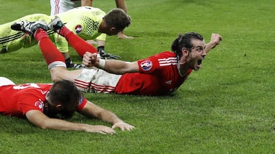 Wales' Gareth Bale celebrates with teammates after their Euro 2016 win over Belgium on Friday night. Darren Staples / Reuters / July 2, 2016