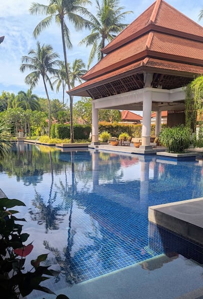 Waiting to check in by the main pool, I'm treated to a gentle shoulder massage. Hayley Kadrou / The National