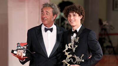 Director Paolo Sorrentino and Filippo Scotti pose with the Silver Lion Grand Jury Prize and the Marcello Mastroianni Award for Best New Young Actor for 'The Hand of God. Getty Images