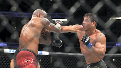 ANAHEIM, CALIFORNIA - AUGUST 17: Paulo Costa throws a punch at Yoel Romero in the third round during their Middleweight Bout at UFC 241 at Honda Center on August 17, 2019 in Anaheim, California. Joe Scarnici/Getty Images/AFP