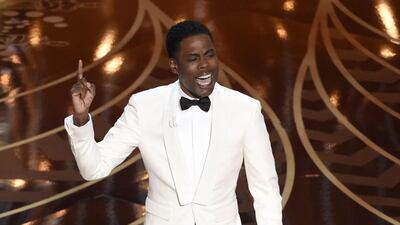 Chris Rock delivers his opening monologue at the Oscars in Los Angeles (Photo by Chris Pizzello/Invision/AP, File)