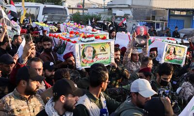 Mourners carry the coffins of Iraq's Kataib Hezbollah fighters who were killed by US air strike in Jurf Al Sakhar, at a funeral in Baghdad. Reuters