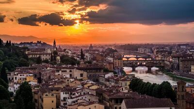 13. A panoramic view of the bridge Ponte Vecchio mirroring in the river Arno from the Piazza Michelangelo in Florence. Getty Images