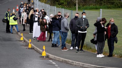People wait to be vaccinated in Bolton as the town sees a surge in Covid-19 cases. Reuters