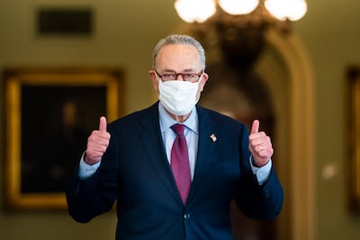 Democratic Senate Majority Leader Chuck Schumer gives a thumbs-up after the Senate voted to approve President Biden's Covid relief package in the US Capitol in Washington. EPA