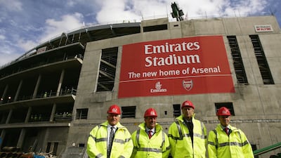 Maurice Flanagan, vice chairman and group president of Emirates, Arsenal FC chairman Peter Hill-Wood, Arsenal manager Arsene Wenger and Keith Edelman, Arsenal managing director, outside the club's new Emirates Stadium development in north London in 2004. Getty Images