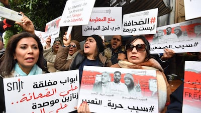 Tunisian journalists protest against the government and call for the release of their colleague Zied El Heni. AFP