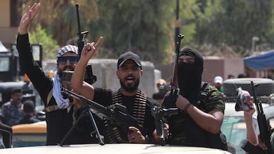 Armed men loyal to Moqtada Al Sadr in Baghdad. EPA