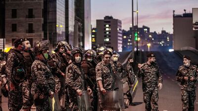 Lebanese riot police stand guard during an anti-government protest against the collapsing Lebanese pound currency and the price hikes of goods in Beirut. EPA