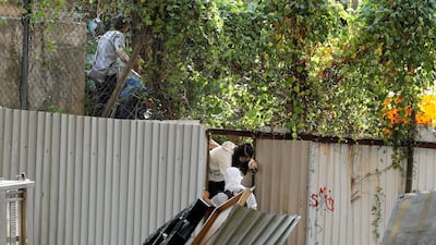 Protesters return to the Hong Kong Polytechnic University campus after being spotted by police during protests. REUTERS