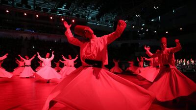 Whirling dervishes perform a "Sema" ritual during a ceremony to mark the 744th anniversary of the death of Mevlana Jalaluddin Rumi, the father of Sufism, at Mevlana Cultural Center in Konya. Adem Altan / AFP Photo