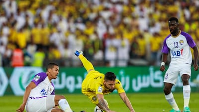 Al Wasl, in yellow, in action against Al Ain during their President's Cup final at Zayed Sports City Stadium on Thursday. Victor Besa / The National