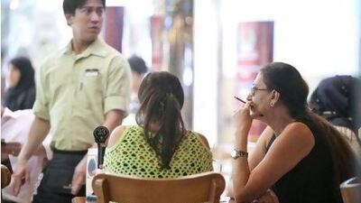 Despite an impending smoking ban and the restaurant being recently fined for the smokers, people continue to smoke inside the Mug&Bean Cafe at the Mushrif Mall in Abu Dhabi.